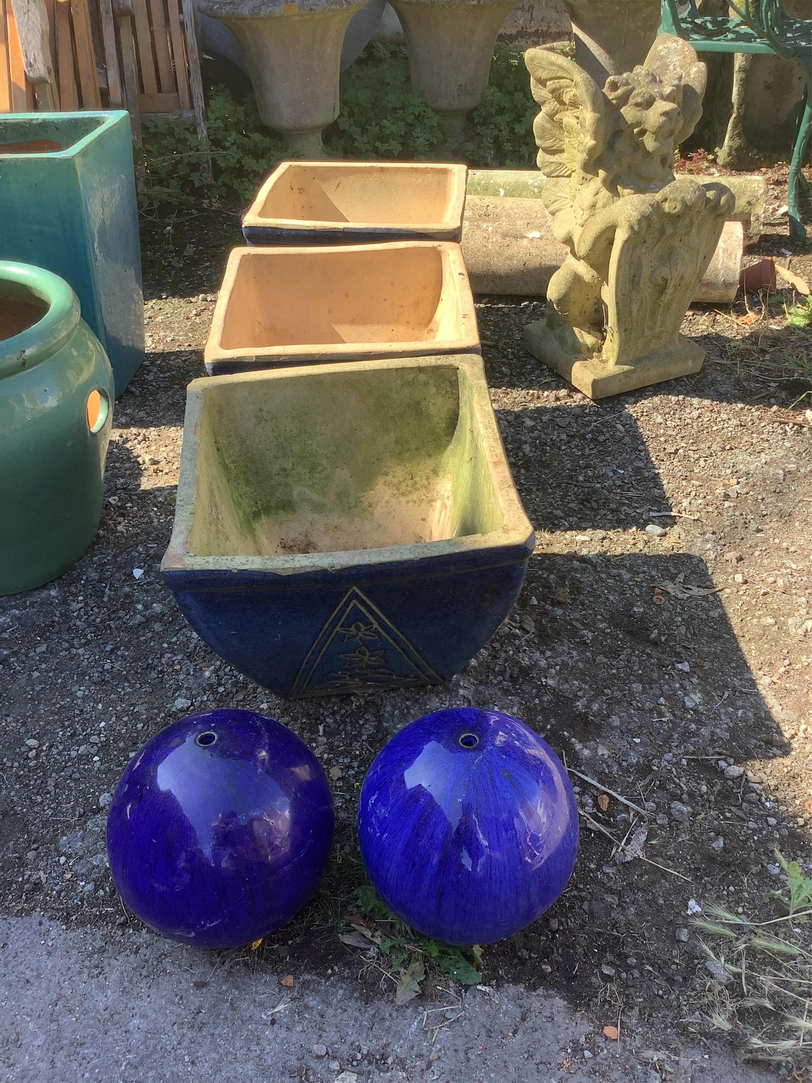 Three square earthenware garden planters and a pair of ball finials, largest width 37cm, height 30cm. Condition - fair